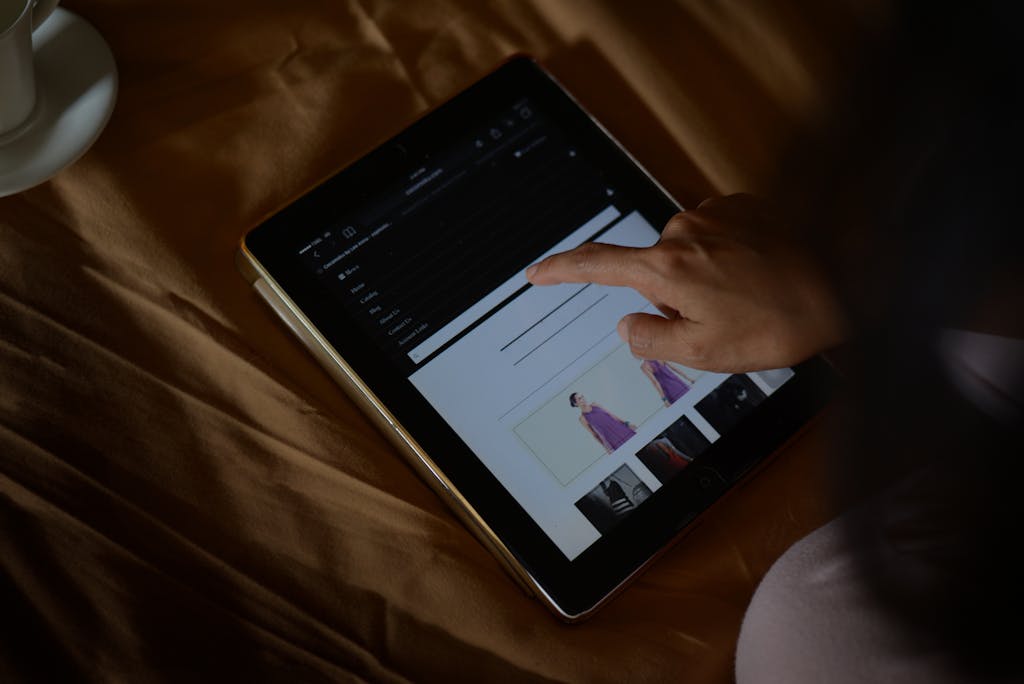 A woman browses an online shopping site on a tablet. Perfect for ecommerce and technology themes.